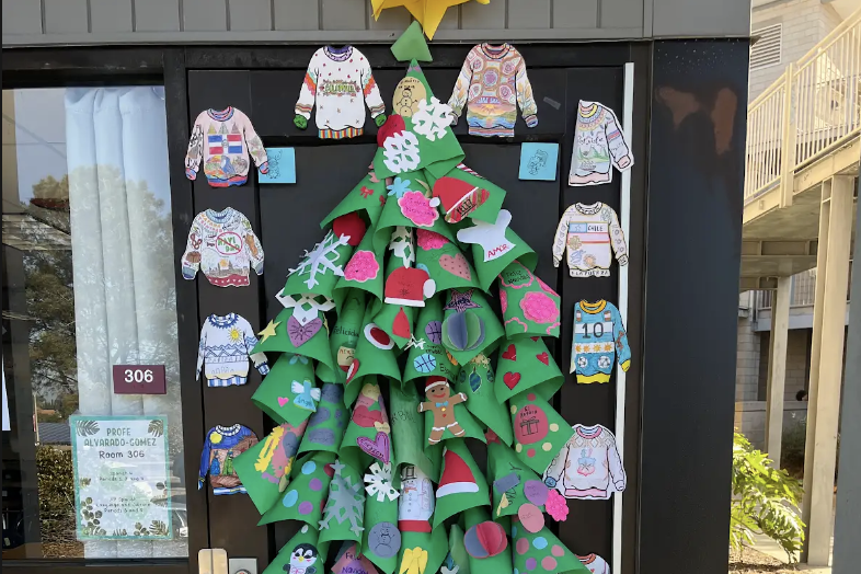 Spanish teacher Viviana Alvarado-Gomez's door displays a 3D tree. Sweaters that represent different cultures surrounded the tree, worked on by the students of her first period class.